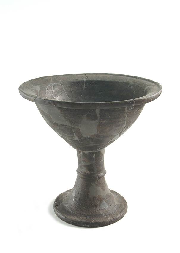      Basin on a high imitation metal foot, of local ‘bucchero’ ware production.